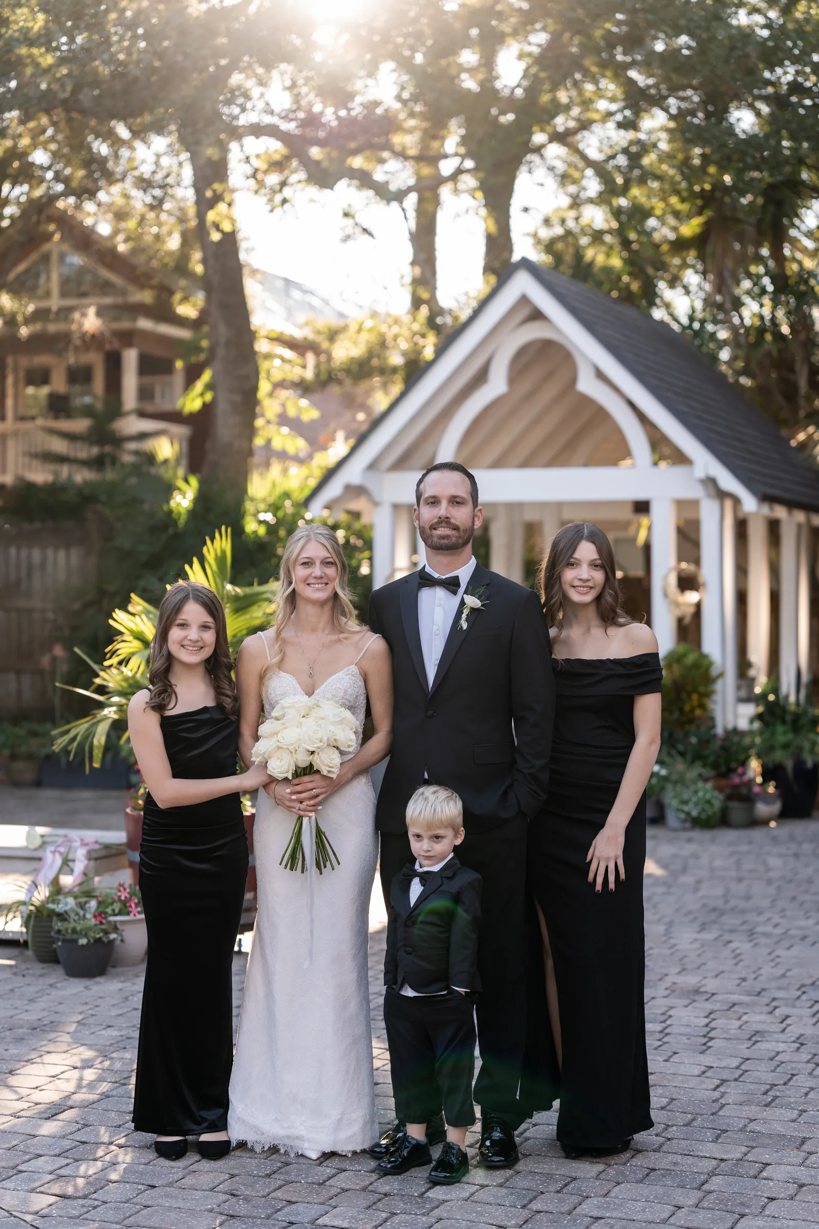 Family portrait with bride, groom and children at St Augustine wedding