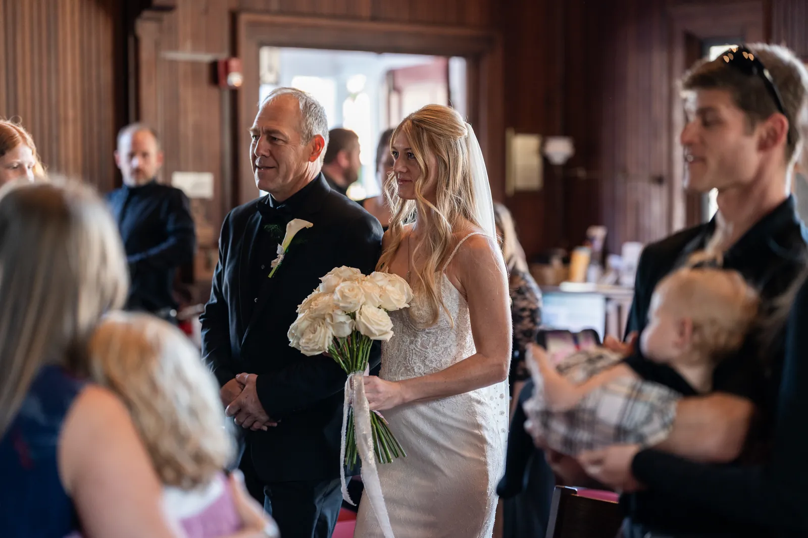 Bride walking down the aisle with her father at St Cyprians Church