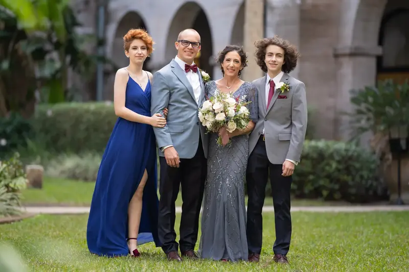 Blended family portrait in the Lightner Museum courtyard