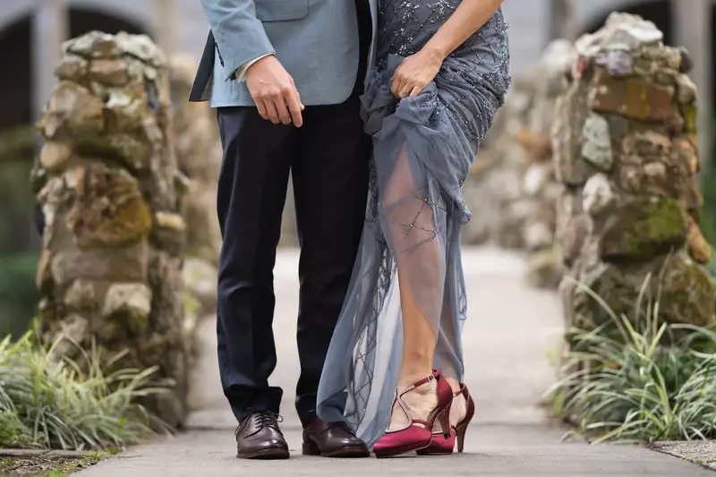 Detail shot of their shoes on the courtyard bridge