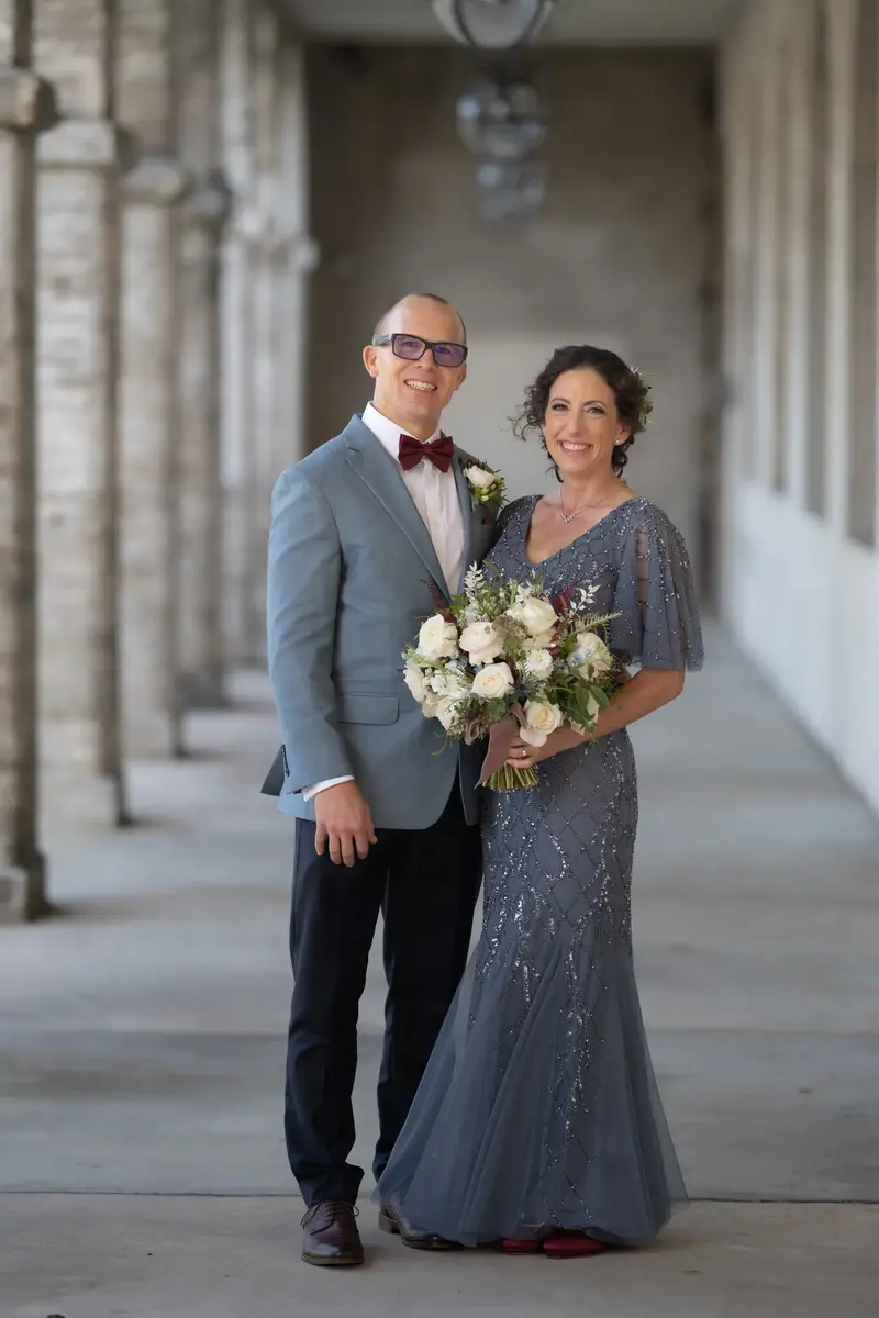 Couple portrait in the colonnade with hanging lanterns