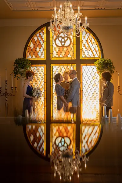 St. Augustine elopement photographer captures couple's ceremony reflected on polished floor at the Lightner Museum