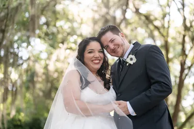 White floral wedding arbor under oak trees, St. Augustine wedding photographer venue