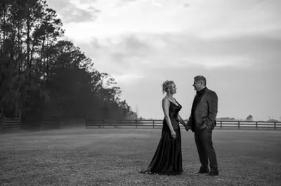 Dramatic couple portrait in misty pasture at Kelly Farm Events