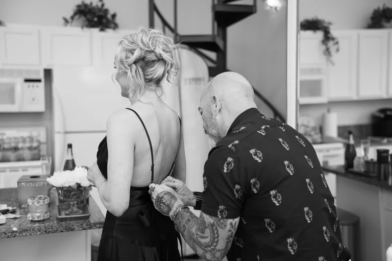 Bride getting ready in black wedding dress