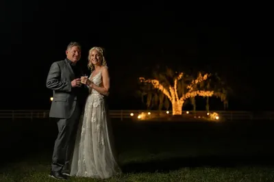 Hamilton and Michelle night portrait with illuminated oak tree