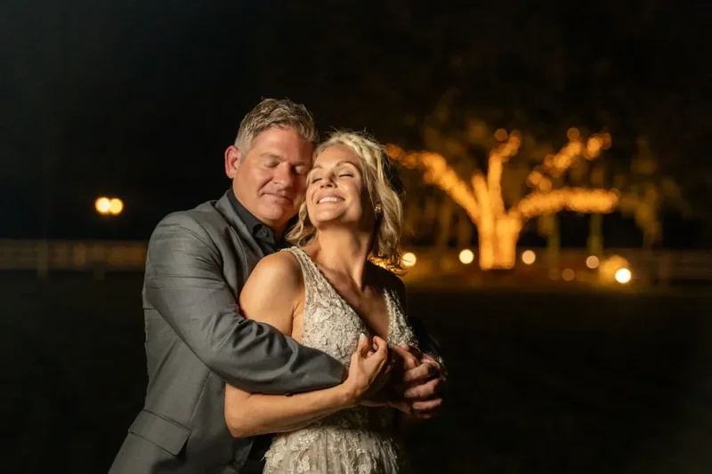 Hamilton and Michelle couple portrait at Kelly Farm Events with barn in background