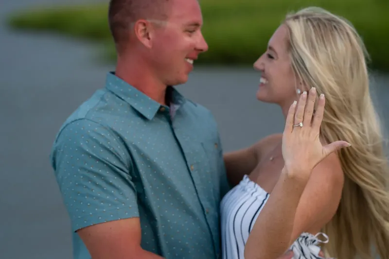 Close-up of Summer showing engagement ring while laughing