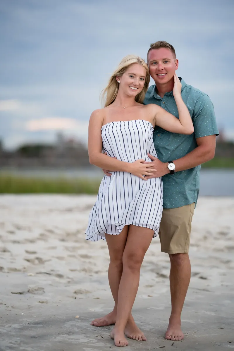 Standing portrait of engaged couple on beach
