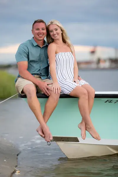 St. Augustine proposal photographer captures couple on turquoise boat after sandbar proposal