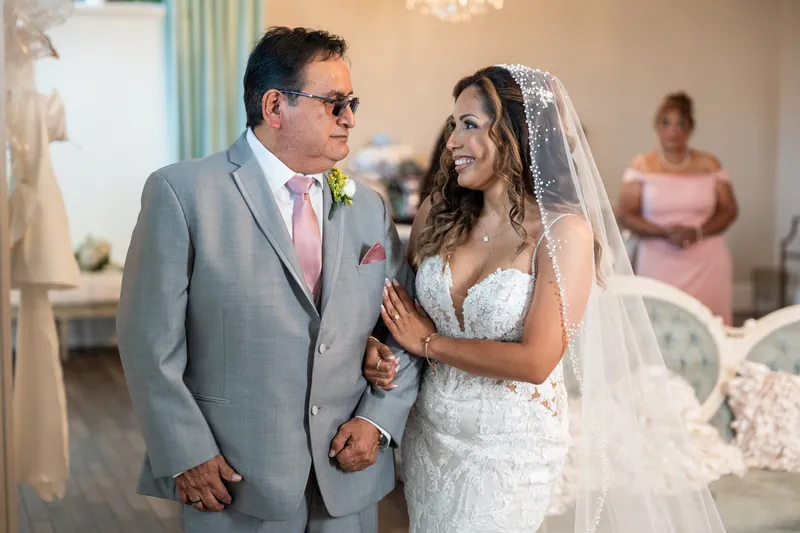 Janet and Rick share a joyful moment together during their ceremony at The White Room, St. Augustine.