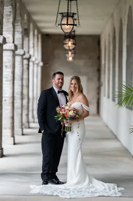 St. Augustine elopement photographer captures bride with dog in formal attire