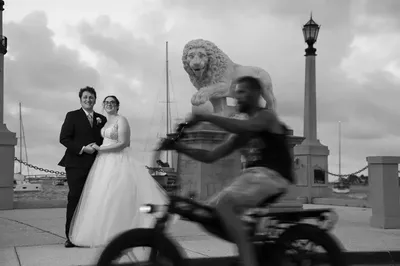 Jess and Thomas at Bridge of Lions in St. Augustine with cyclist motion blur