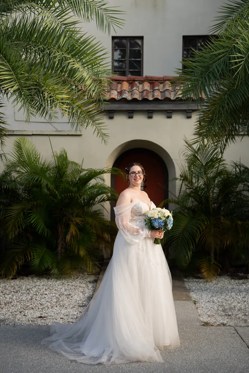 Bridal portrait with Spanish colonial architecture and palm trees in St. Augustine