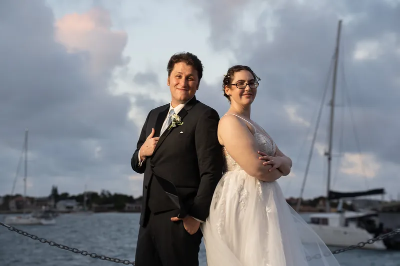 Couple portrait at St. Augustine bayfront with sailboats