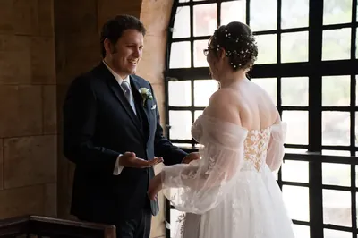 Couple during first look with beautiful window light