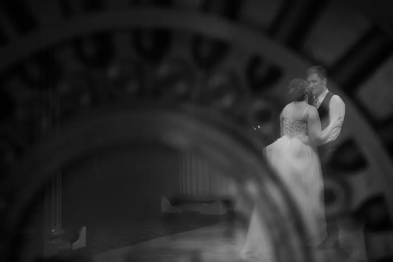 Artistic portrait of couple through Treasury vault door