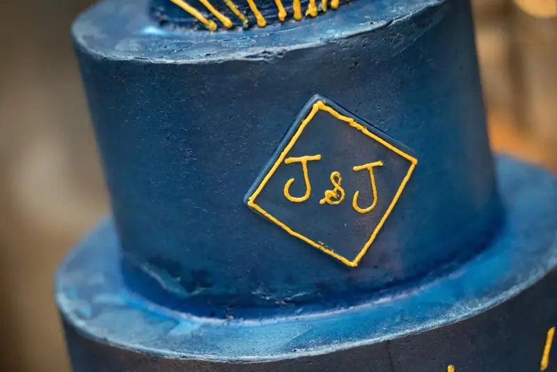 Blue wedding cake initials J J