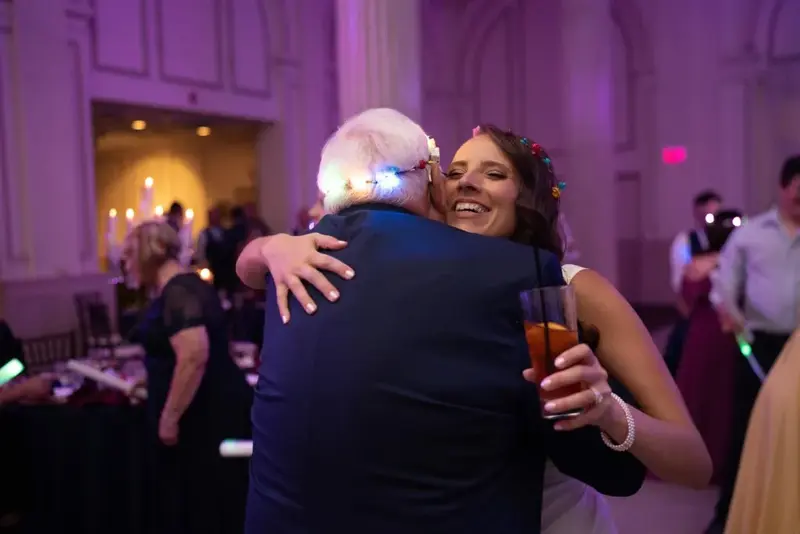 Joyful embrace at the reception