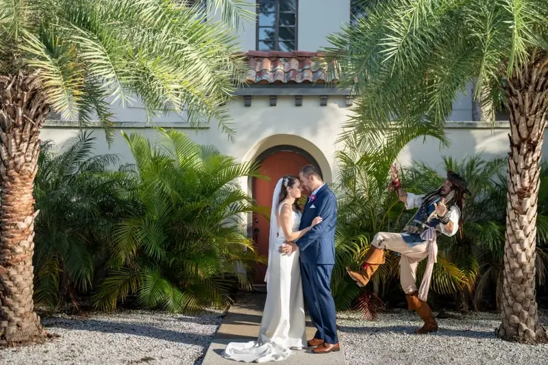 Wedding kiss with pirate photobomb