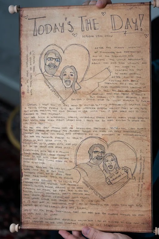 A handmade wedding invitation titled "TODAY'S THE DAY" features illustrated portraits and handwritten text on aged paper.