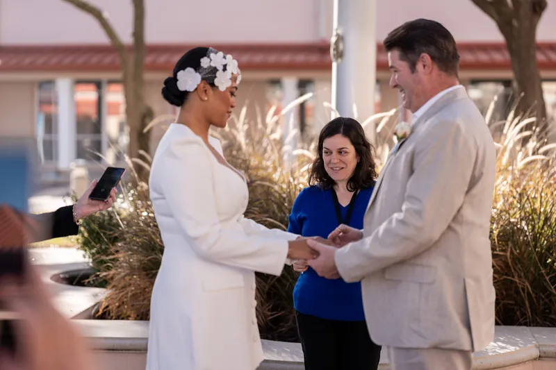 Josh and Diane hold hands during their courthouse ceremony in St. Augustine