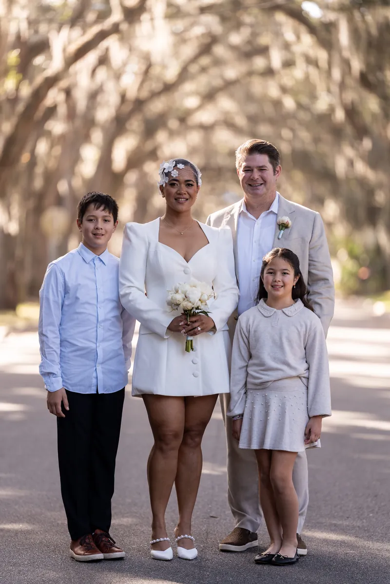 Family portrait with two children on Magnolia Street under the oak tree canopy