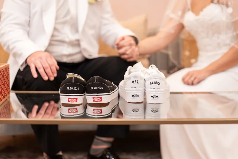 Custom Vans sneakers with wedding date and Mrs. Maenpa printed on them