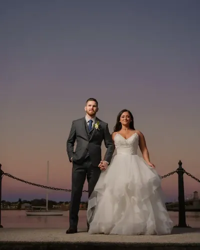 Katherine and Michael at sunset on the St. Augustine bayfront seawall with Bridge of Lions