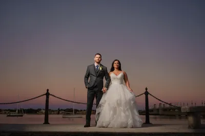 Katherine and Michael at sunset on the St. Augustine bayfront seawall with Bridge of Lions