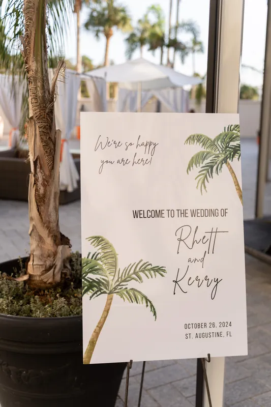 A welcome sign with palm tree illustrations stands on an easel at Casa Monica Resort & Spa, introducing guests to Rhett