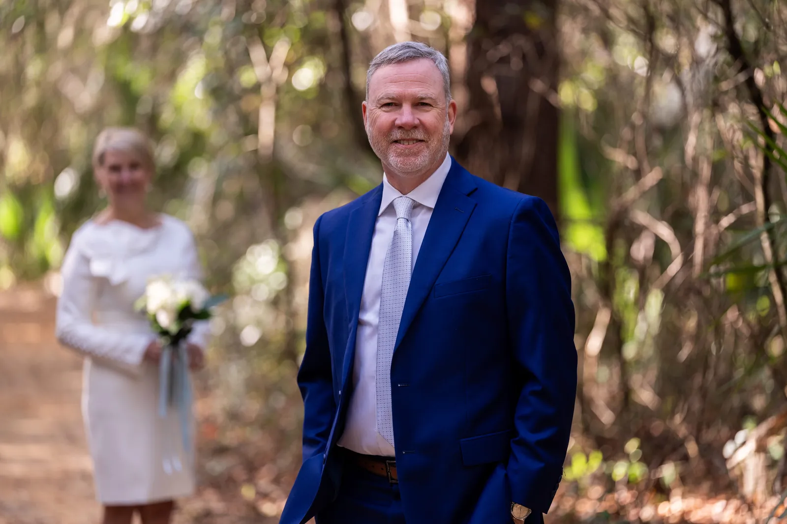 Couple walking hand in hand at Fort Mose