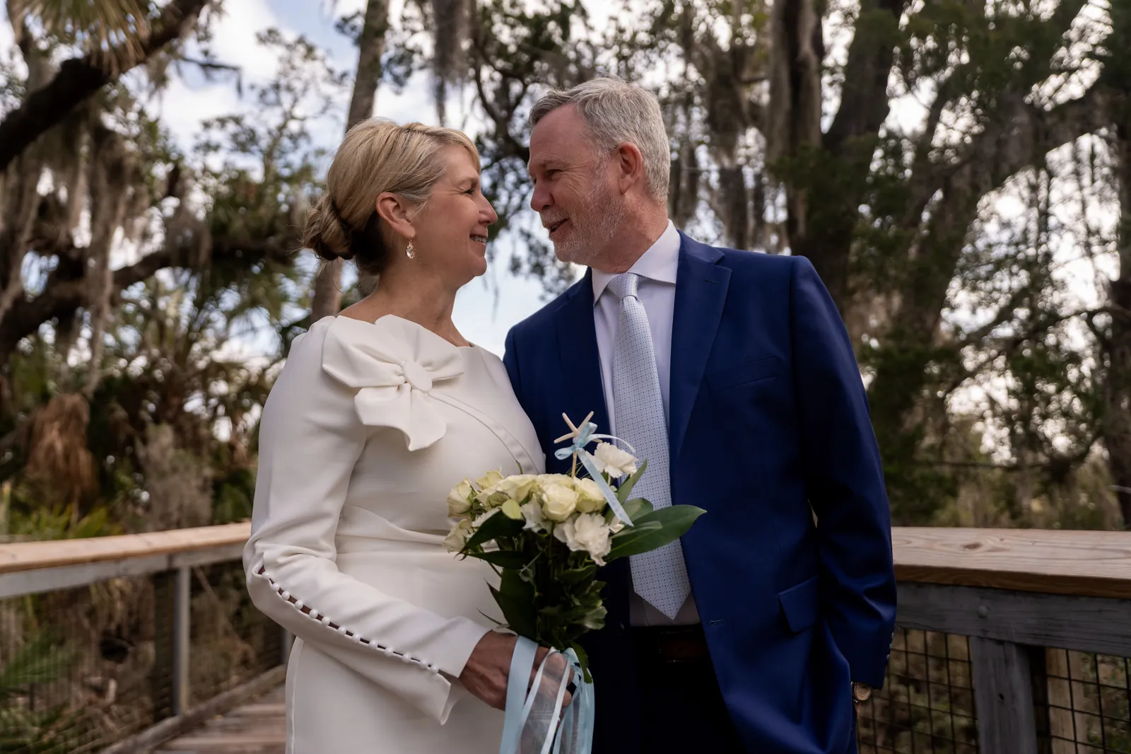 Couple walking through Fort Mose park