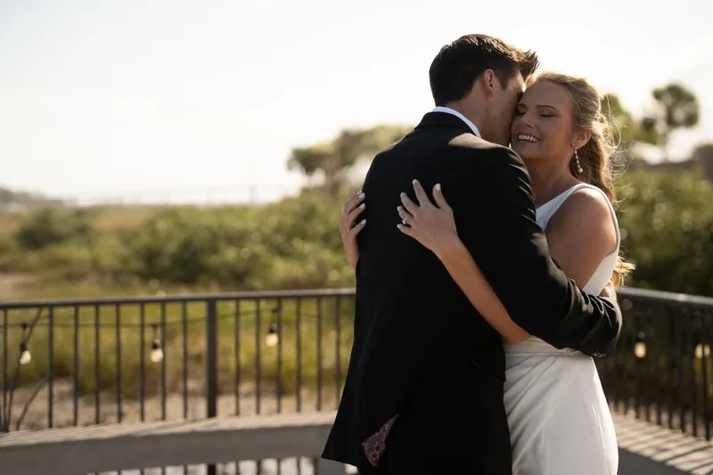 Joyful embrace at outdoor ceremony