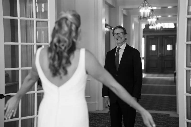 Joyful moment in elegant hallway