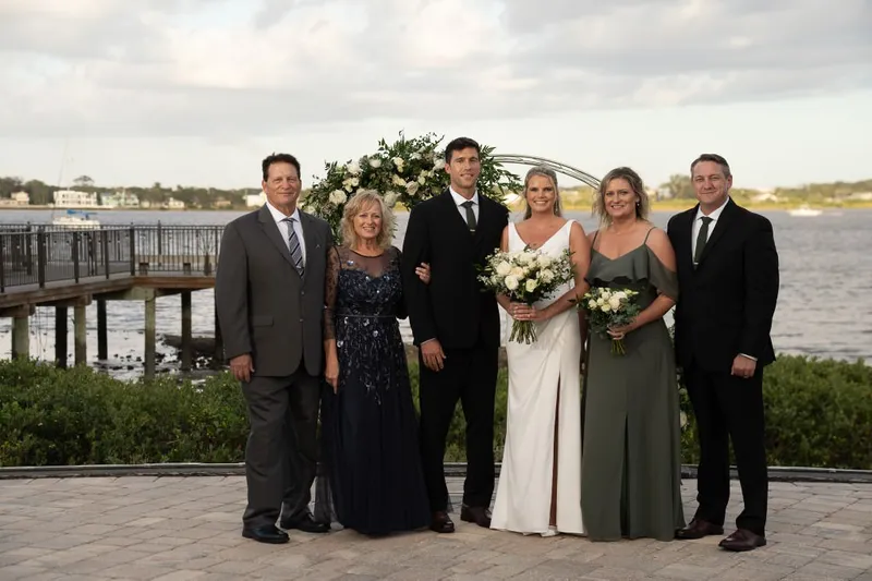 Family portrait by the water at River House
