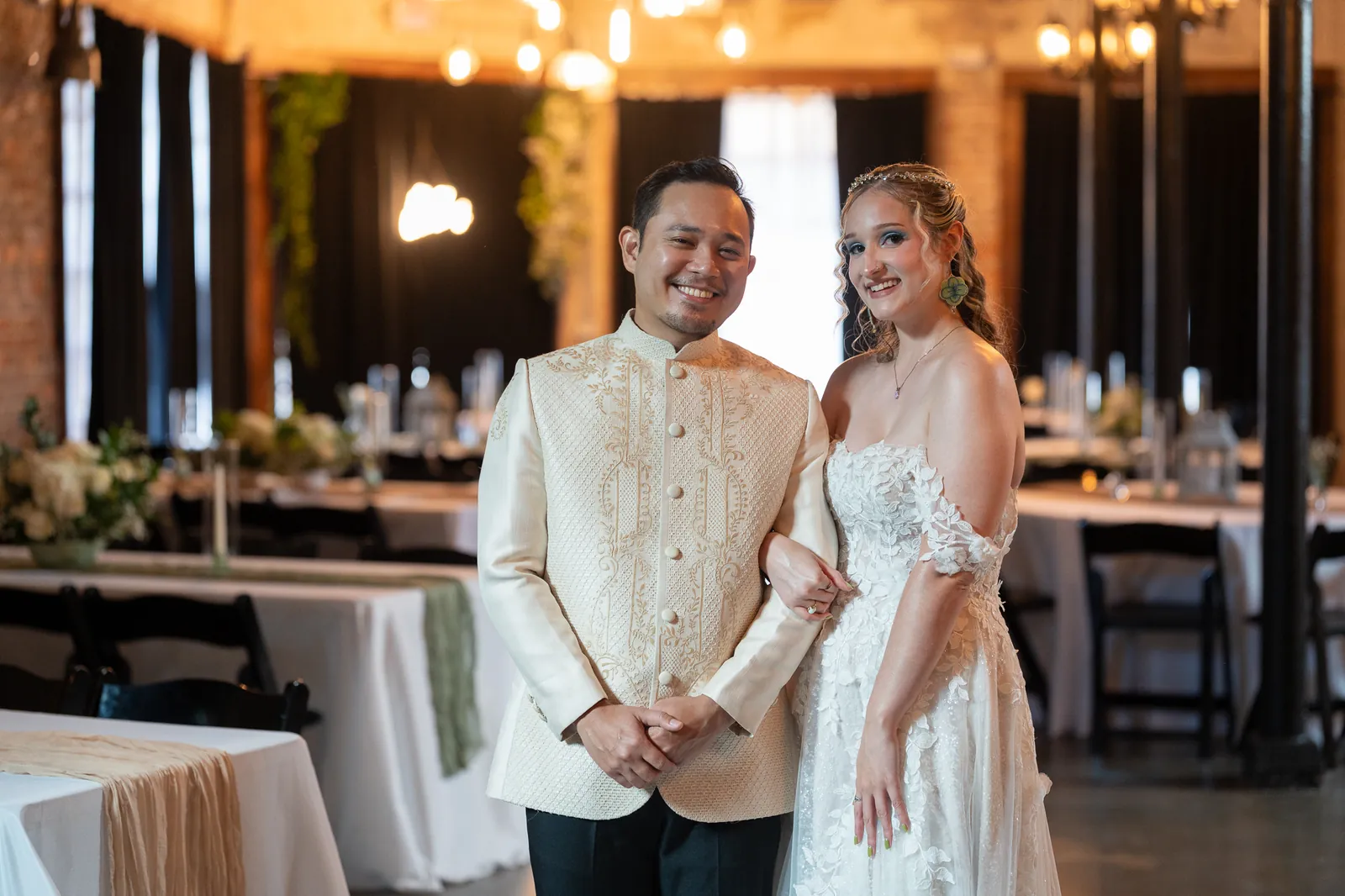 Couple portrait inside industrial venue with Edison bulbs at Brick and Beam