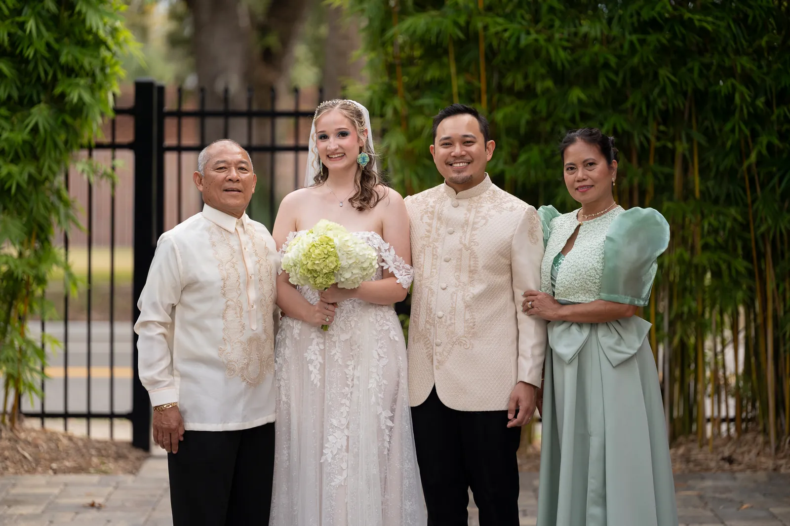 Family portrait with Judd's parents in traditional Filipino attire Barong Tagalog and Filipiniana