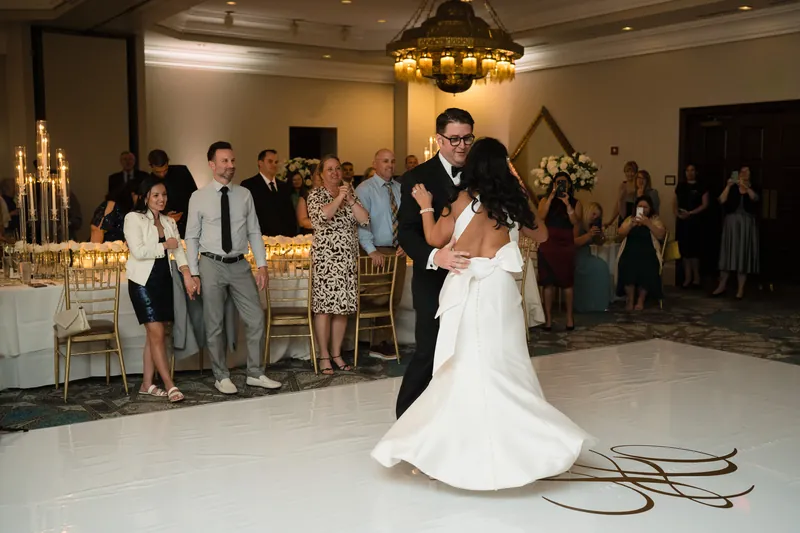 Cole and Lehna dance at Casa Monica Resort & Spa while guests watch from the elegant ballroom.