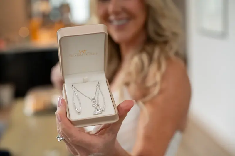 Bride showing off William Thomas jewelry set