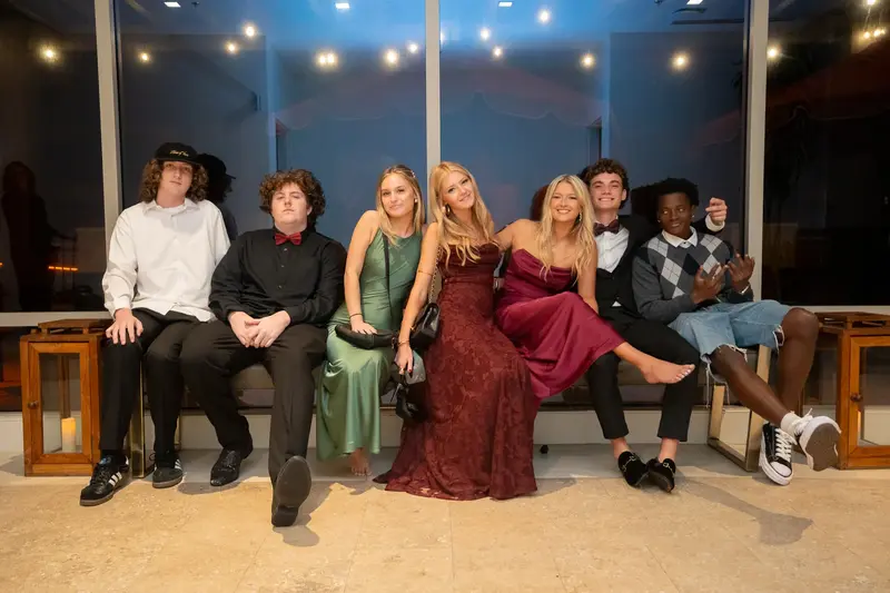 Guest dancing with plate on dance floor