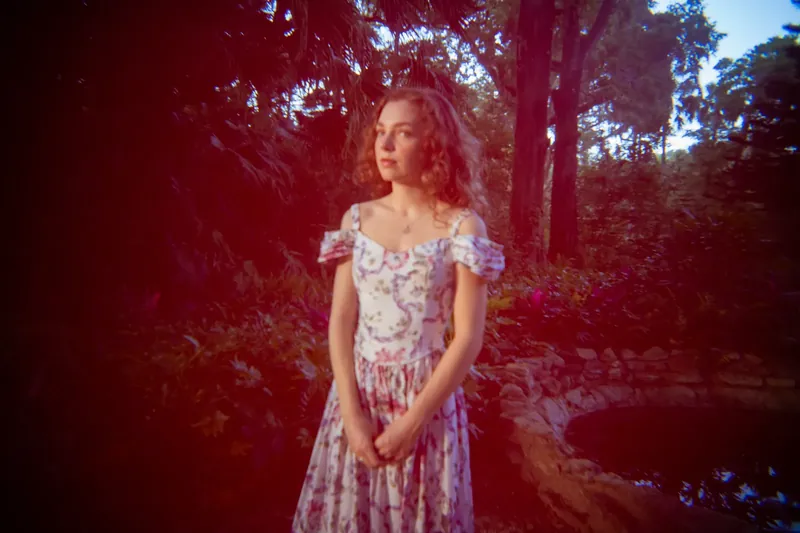 Lydia in garden with lo-fi lens effect