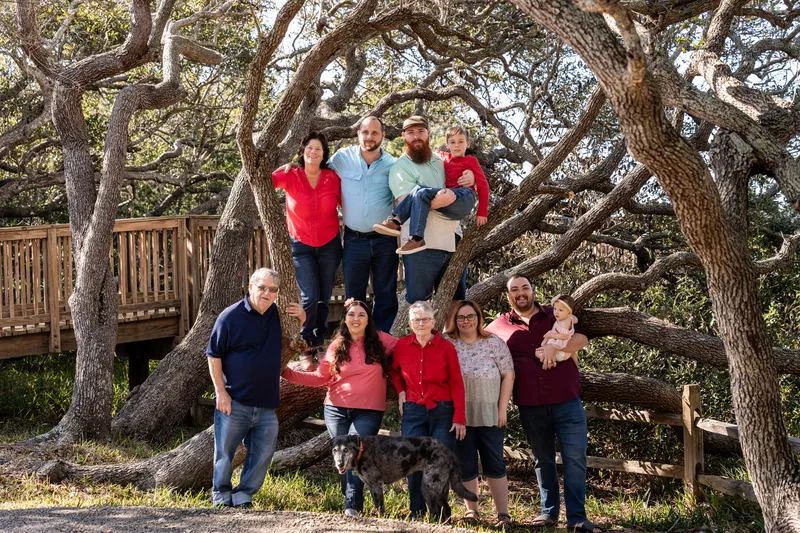 Four generations of the Lynn family gathered around the big oak tree at Nease Park
