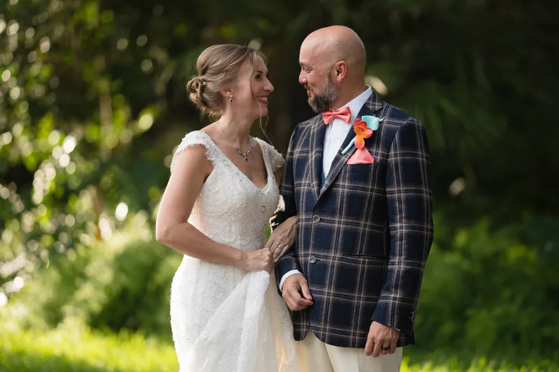 Couple gazing at each other in lush garden setting