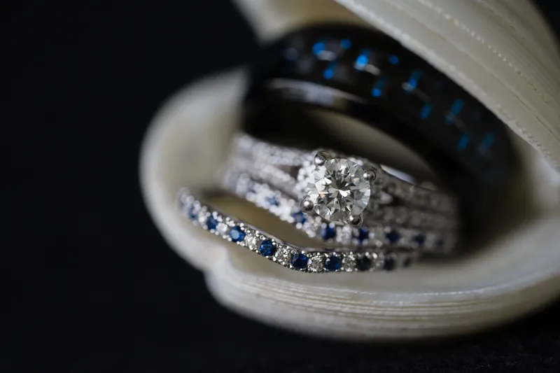 Wedding rings with sapphire accents in ring box