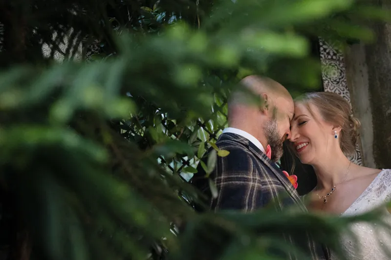 Couple on bayfront with pirate ship in background