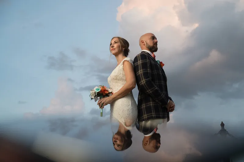 Artistic portrait with cloud reflection creating mirror effect