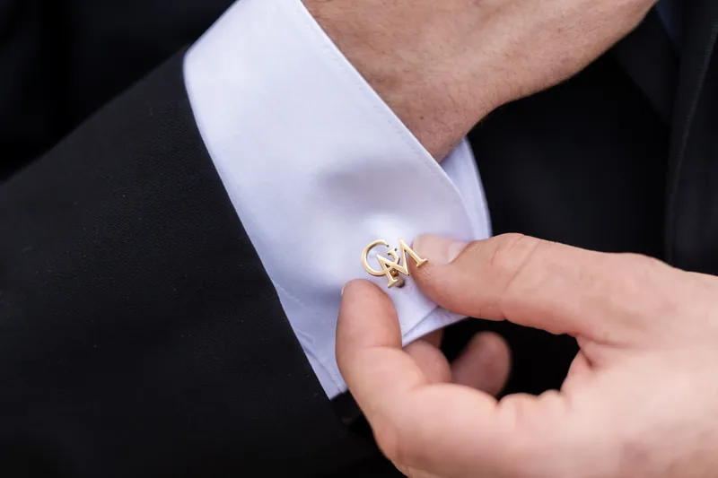 Gold GM monogram cufflinks close-up on wedding day