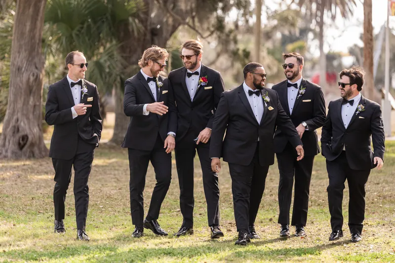 Groomsmen walking together in sunglasses
