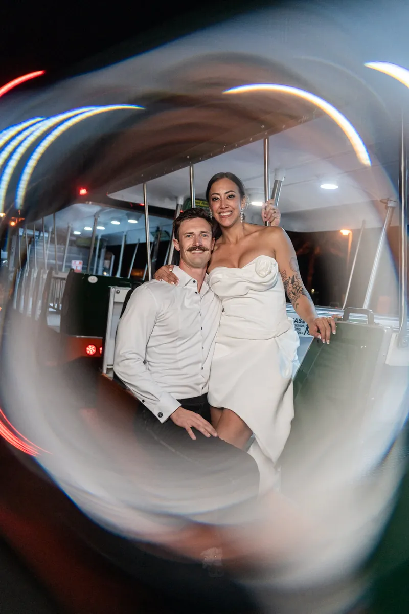 Couple on the party trolley with light trail effect at end of the night